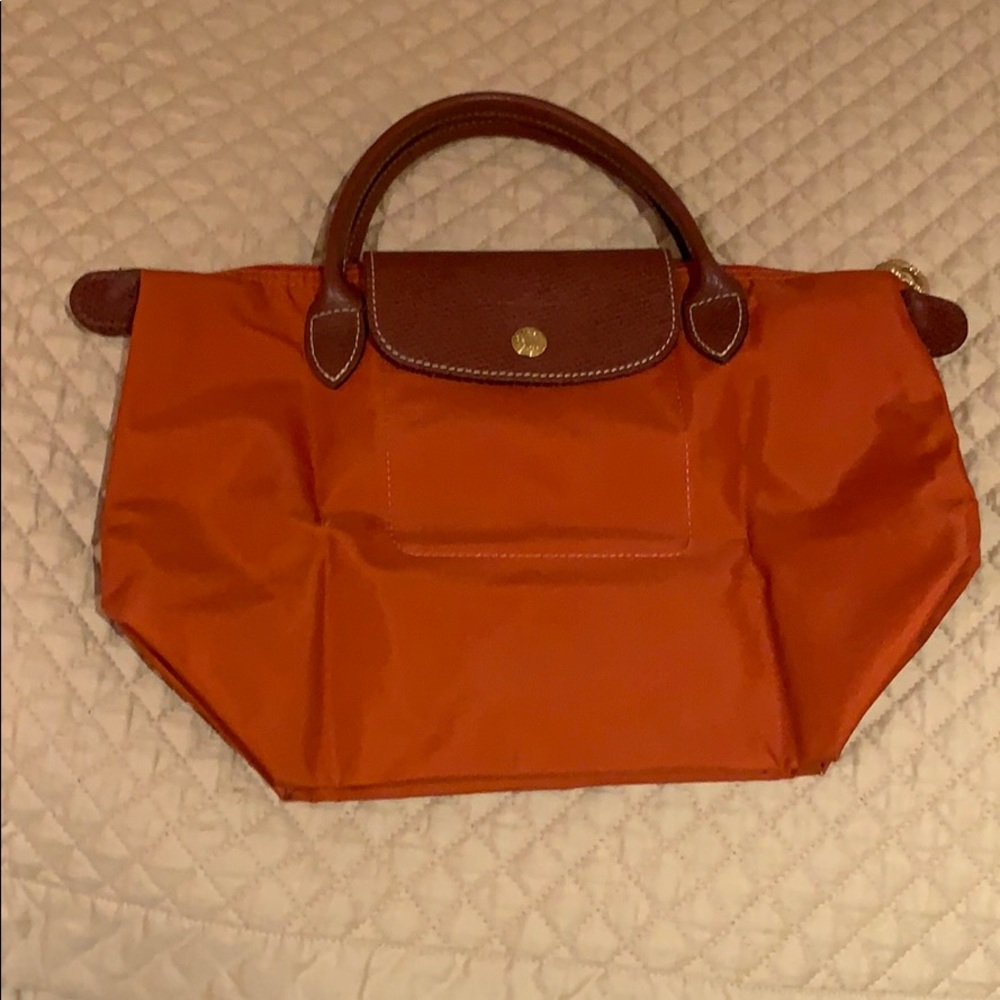 Orange Longchamp short handled small purse
